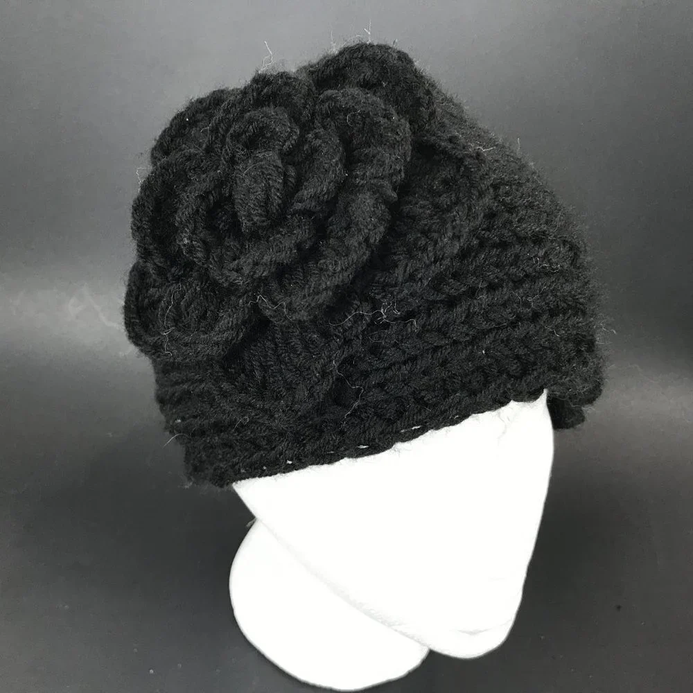 Wool blend black hand knit headband with flower accent